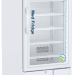 A white, upright medical refrigerator on wheels with a clear glass door, digital temperature display, interior LED lighting, and multiple wire shelves. The words “Med Fridge” and a blue-green sticker are visible on the door. The brand “ABS” is on the top panel.