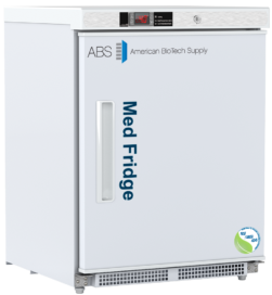 A white medical ADA-compliant refrigerator branded ABS American BioTech Supply with Med Fridge written vertically on the right hinged door. It has a digital temperature display, a rectangular handle, and a NSF/ANSI compliant certification sticker on the lower right corner.