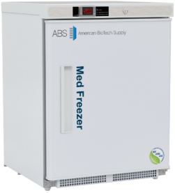 A white medical freezer with ABS American BioTech Supply and Med Freezer text on the door. An electronic display shows -20.0°C. The freezer has a handle, a lock, and a green energy seal at the bottom right corner. This NSF/ANSI 456 compliant vaccine freezer is right hinged.
