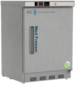 A stainless steel NSF/ANSI 456 certified medical vaccine freezer labeled Med Freezer by American BioTech Supply, with a digital temperature display on top showing -20°C, a handle on the left, a vent at the bottom, and a certification sticker on the lower right corner.