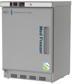 A compact stainless steel vaccine storage under-counter medical freezer by American BioTech Supply, labeled Med Freezer, with a digital temperature display, solid door, vertical handle, and NSF/ANSI 456 certification sticker on the lower right front.