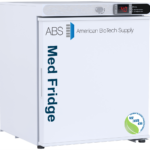 A white Freestanding Countertop Vaccine Refrigerator with ABS and American BioTech Supply logos, digital temperature display at 4.8°C, and Med Fridge text on the side. NSF/ANSI 456 certification seal is visible at the lower right corner.