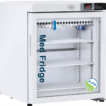 A white medical refrigerator with glass front door, digital temperature display showing 4.8°C, and three wire shelves. The door is labeled “ABS American Biotech Supply Med Fridge.” An NSF/ANSI 456 certification sticker is on the lower right corner.