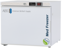 White premier freestanding countertop freezer with ABS American BioTech Supply logo, digital temperature display showing -20.0°C, and blue Med Freezer text on the side. NSF/ANSI 456 certification badge is visible on the bottom right corner.